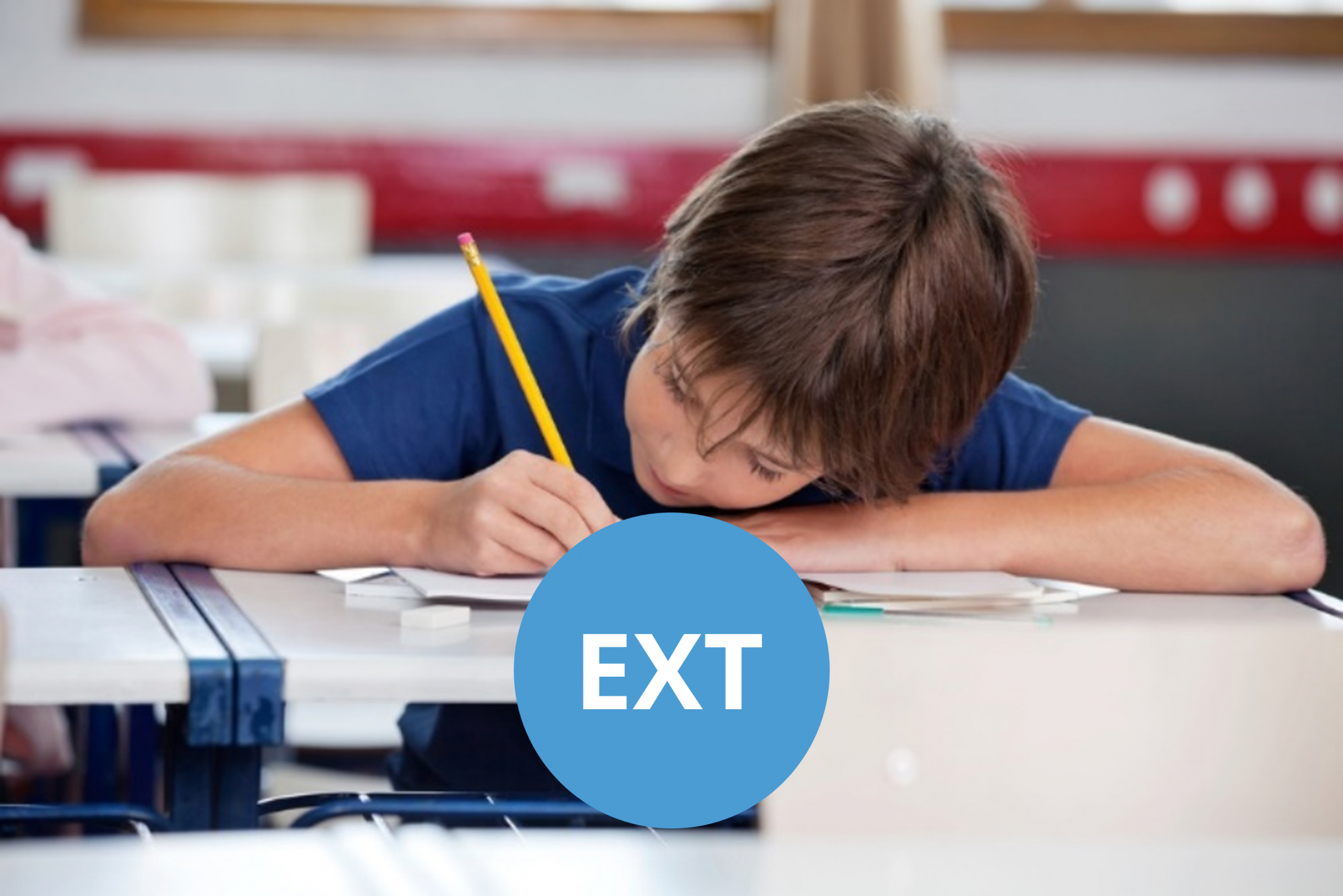Boy writing with a pencil